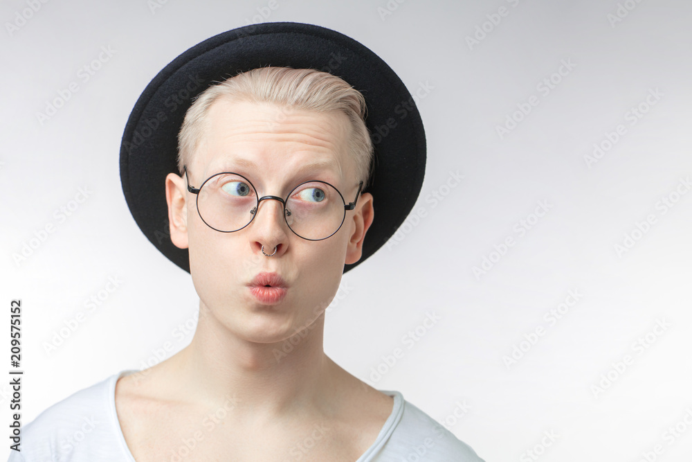 Man Holding Fingers Against Pursed Lips Side View High-Res Stock Photo -  Getty Images