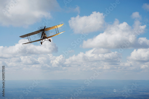 Fototapeta Naklejka Na Ścianę i Meble -  Old airplane on the blue sky
