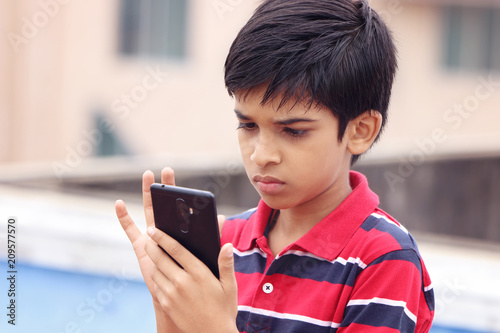      Indian Cute Little Boy With Cellphone 