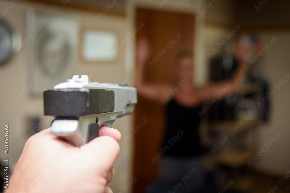 Woman held at gunpoint in her home by a burglar or intruder Woman held at gunpoint in her home by a burglar or intruder