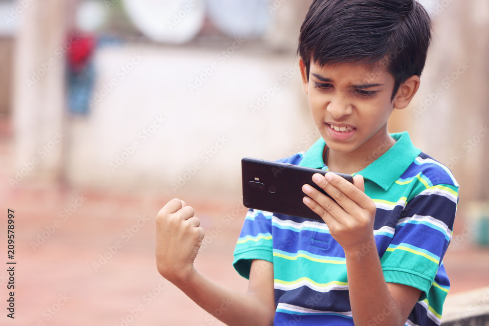Indian Cute Little Boy With Cellphone Indian Cute Little Boy With Cellphone