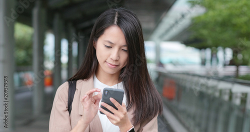 Photography Young Woman use of smart phone in city
