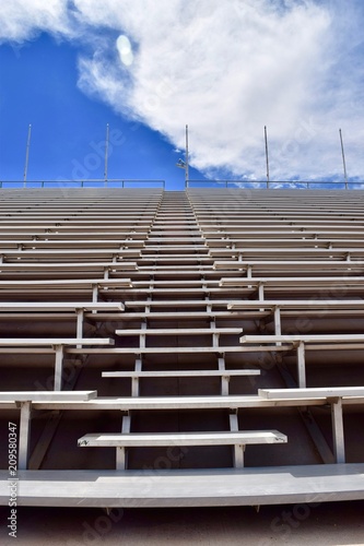 Stadium Bleachers with Blue Sky and Clouds