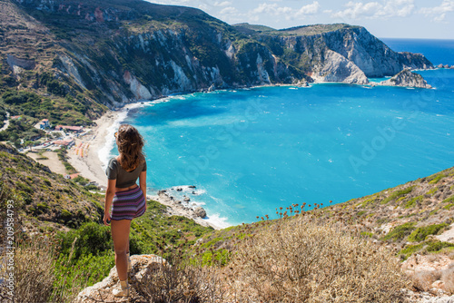 Girl on the top opposite Petani Beach on the Kefalonia Island, Greece