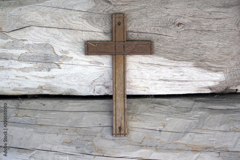 wooden Cross on wooden background wall