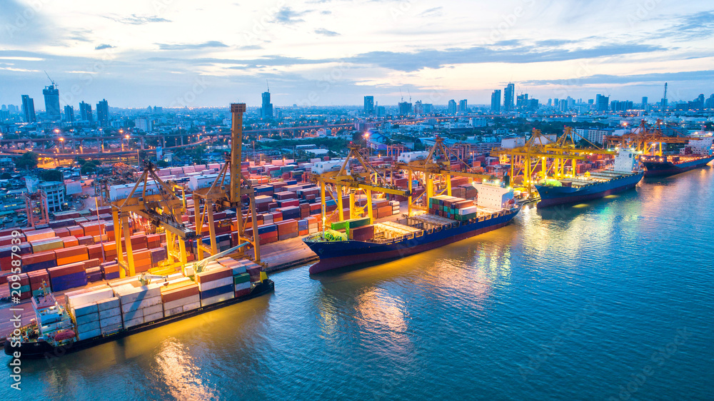 Naklejka premium Container ship in export and import business and logistics. Shipping cargo to harbor by crane. Water transport International. Aerial view and top view.