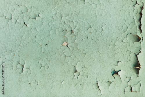 Textured background cracked blue paint on a wooden surface photo