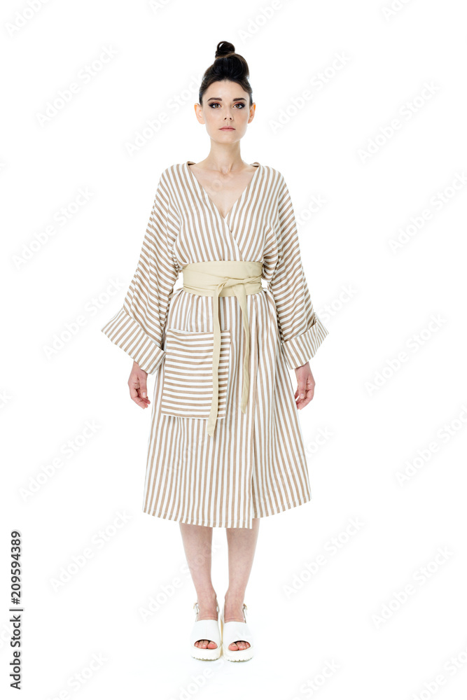 attractive young woman in elegant white dress posing on white background attractive young woman in elegant white dress posing on white background
