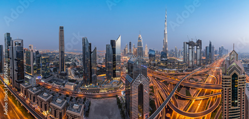 Dubai skyline during sunset with amazing city center lights and road traffic UAE.