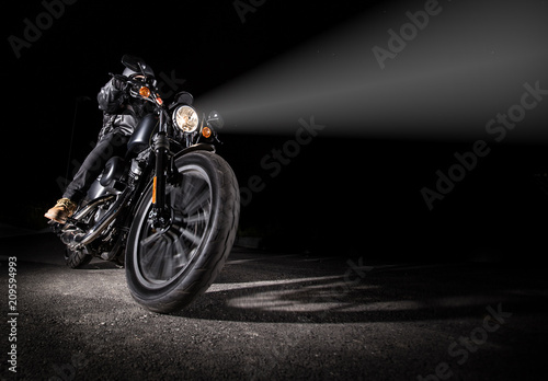 High power motorcycle chopper at night.