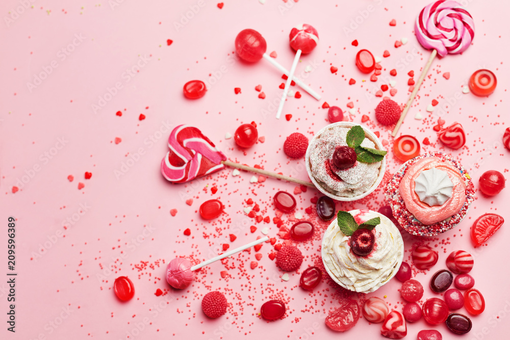 Sweets. Candy And Cupcakes On Pink Background Sweets. Candy And Cupcakes On Pink Background