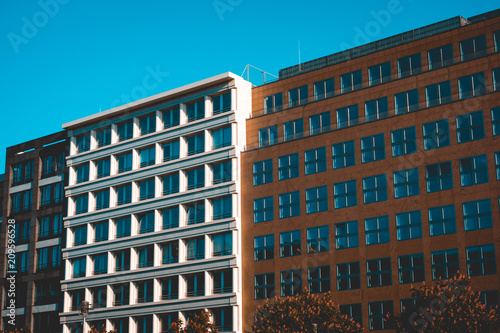 white and orange office building at friedrichstrasse, berlin