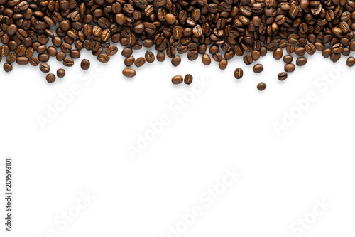 Roasted coffee seeds on white background. top view with space for text photo