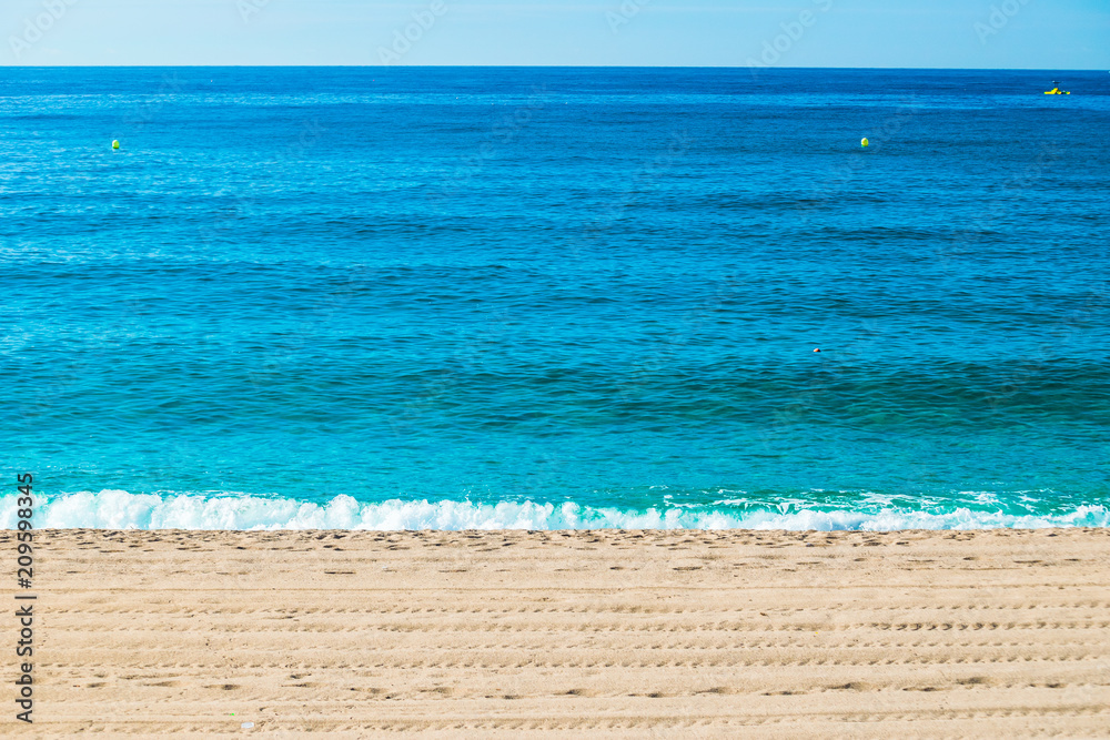 Spain seavies in summer. Blue beach waves.