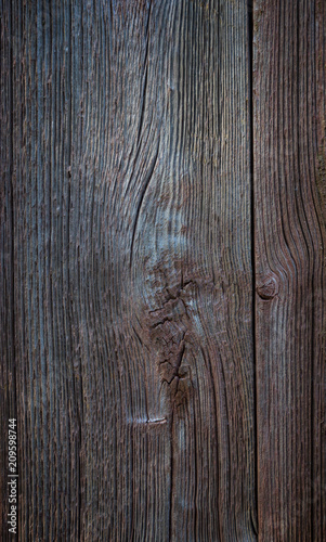 Close-up of an old and unpainted rustic wood board texture background with vignette