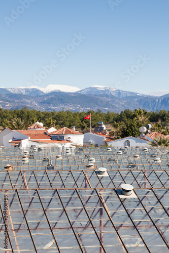 The view across industrial greenhouses on a farm in Turkler in the province of Alanya, looking towards the countryside in southern Turkey. photo