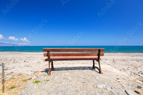 Empty bench at Maleme beach on Crete, Greece