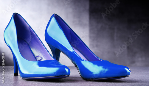 Composition with a pair of blue high heel shoes