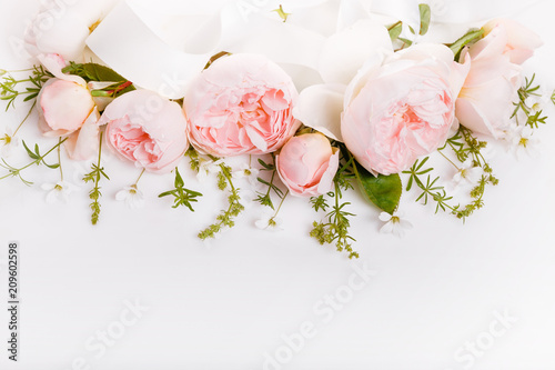 Festive flowers English rose composition on the white background. Overhead top view, flat lay. Copy space. Birthday, Mother's, Valentines, Women's, Wedding Day concept