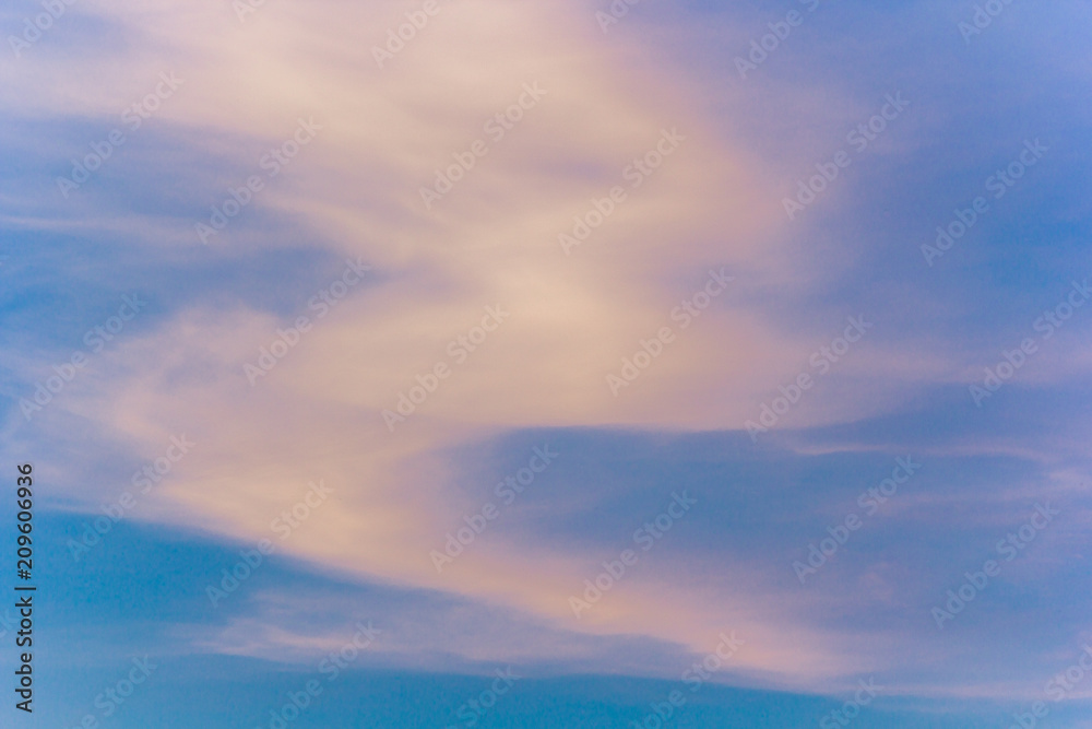 Blue sky with pink clouds at sunset or sunrise