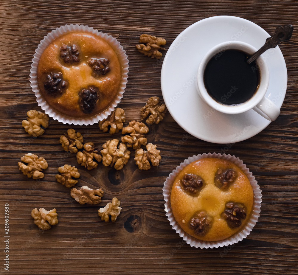 Shortbread cookies with walnuts and honey and cup of black coffee.