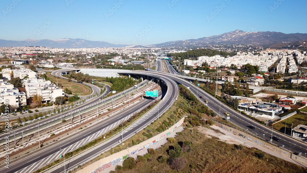 Aerial drone bird's eye view of popular highway of Attiki Odos multilevel junction road, passing through National motorway in traffic jam, Attica, Greece
