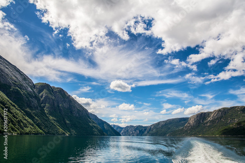Amazing nature view with beautiful clouds above the fjord. Location: Lysefjorden, Norway, Europe. Artistic picture. Beauty world.