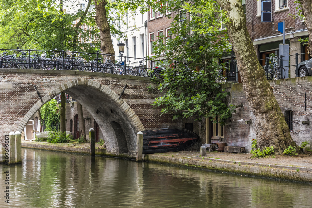 Old bridge with a boat in the center of Utrecht. netherlands