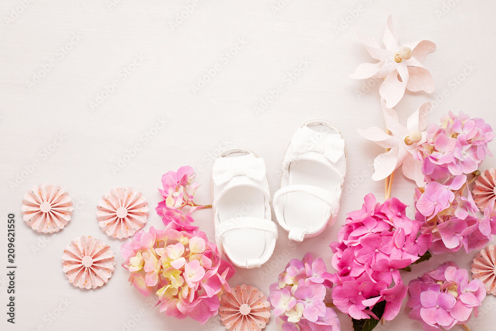 Cute newborn baby girl shoes. Baby shower, birthday, invitation, greeting card - obrazy, fototapety, plakaty 