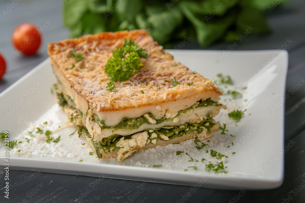 Lasagna with spinach on plate, close up Lasagna with spinach on plate, close up