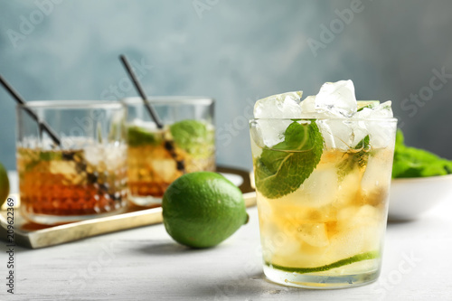 Fényképezés Glass of delicious mint julep cocktail on table
