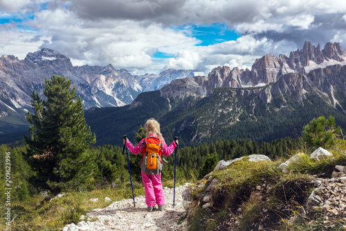 little girl hiker on a path