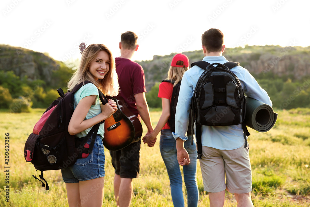 Group of young people in wilderness. Camping season Group of young people in wilderness. Camping season