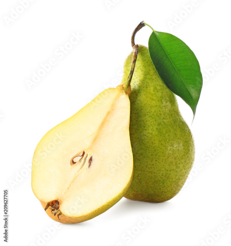Delicious whole and sliced ripe pears on white background