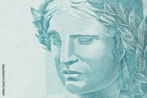 Republic's Effigy portrayed as a bust on Brazilian money. Super macro closeup on one hundred bill. Concept of economy, inflation and business. photo