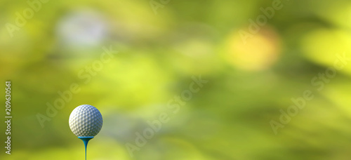 3d rendering of Golf ball on tee over a blurred green