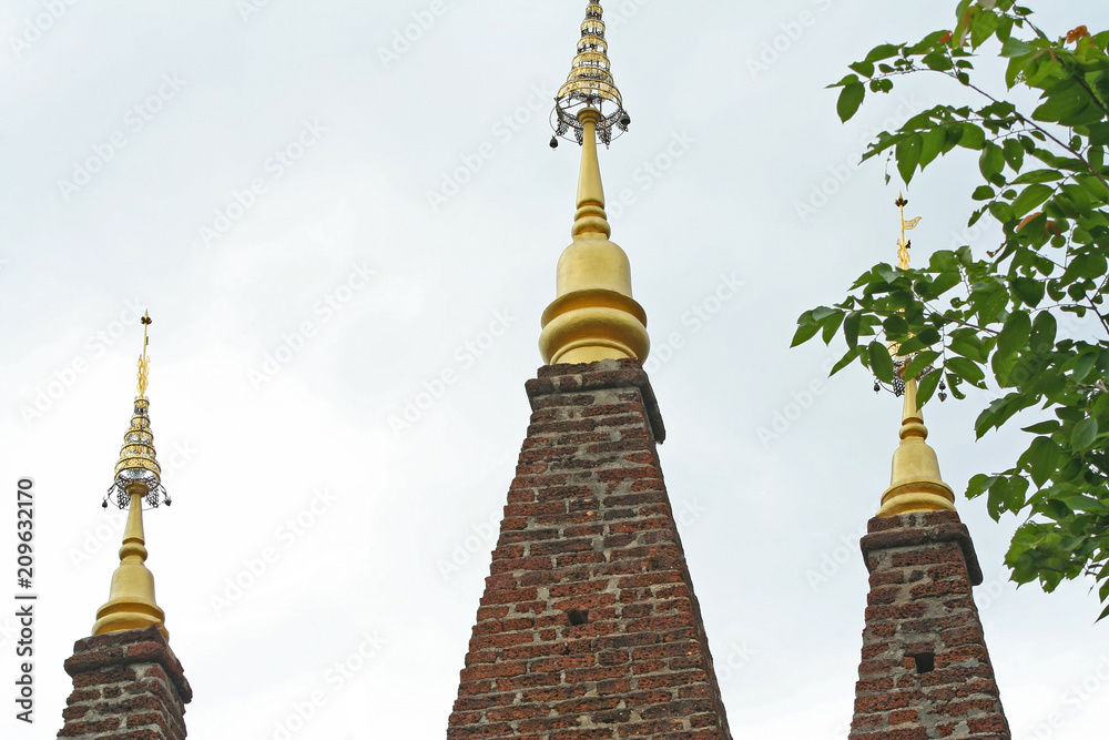 Fototapeta premium Brick with gloden pagoda at Phra Phutthabat Pha Nam temple in Tak ,Thailand