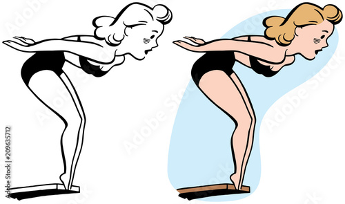 A woman prepares to dive off of a diving board.