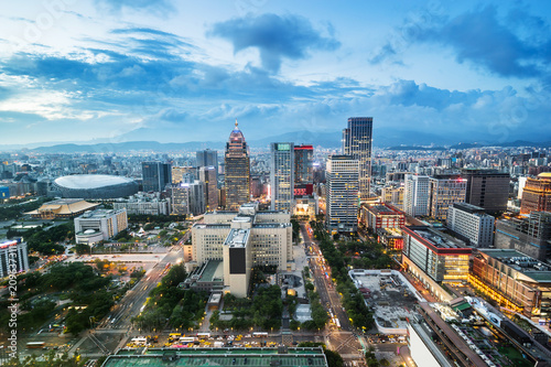 Asia Business concept for real estate and corporate construction - panoramic urban city skyline aerial view and tokyo station under twilight sky and neon night in Taipei  Taiwan