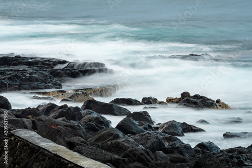 Blurred water with a slow shutter speed, lava shoreline of the Pacific Ocean, Hawaii

