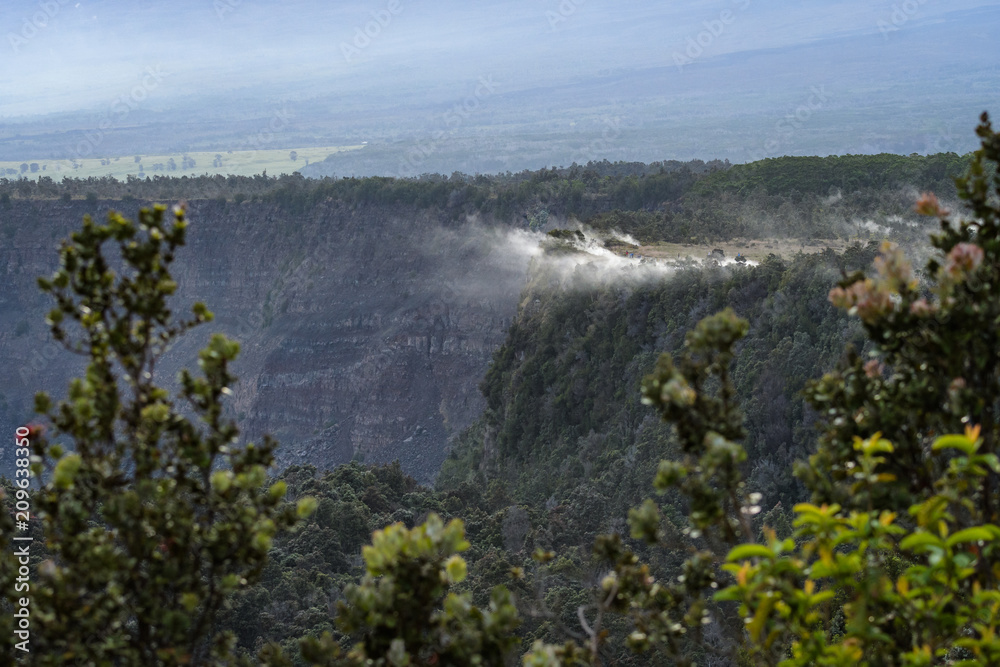Beautiful lush green landscape in Volcanoes National Park, volcanic steam drifting off the edge of a cliff, Hawaii
Beautiful lush green landscape in Volcanoes National Park, volcanic steam drifting off the edge of a cliff, Hawaii