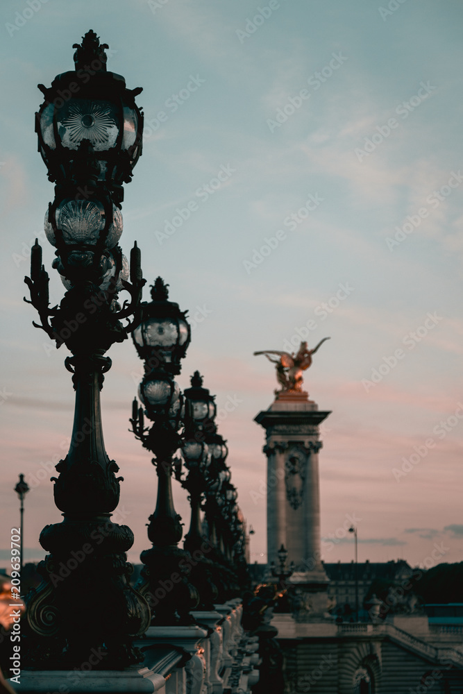 The Alexander III Bridge across Seine river in Paris The Alexander III Bridge across Seine river in Paris