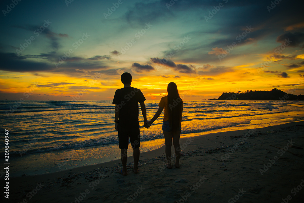 Silhouette of the lover at the beach during a beautiful sunset
