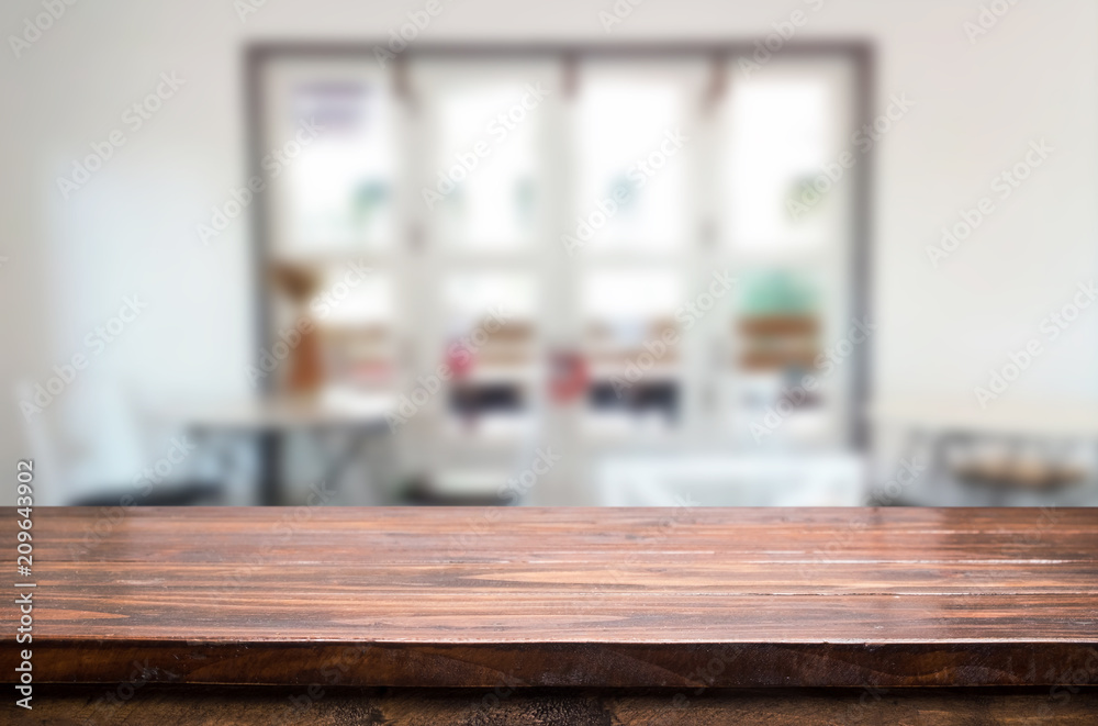 Selected focus empty brown wooden table and Coffee shop blur background with bokeh image. for your photomontage or product display Selected focus empty brown wooden table and Coffee shop blur background with bokeh image. for your photomontage or product display