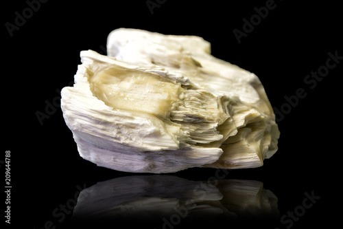 Crystal of gypsum mineral stone isolated on black photo