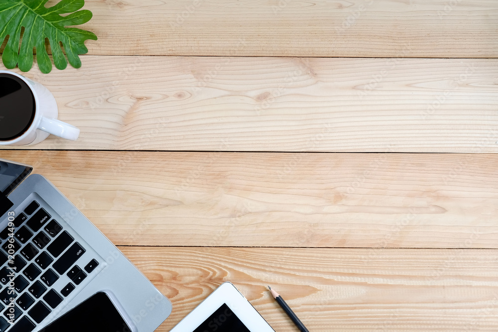 Workspace with laptop, tablet, smartphone and coffee cup on wooden desk. Workspace with laptop, tablet, smartphone and coffee cup on wooden desk.