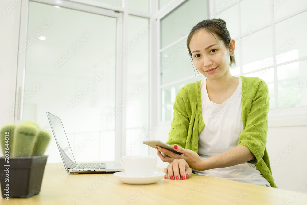 Obraz premium Asian woman using laptop at home,