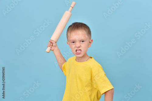 The boy is fighting. Bad child. Evil teenager.