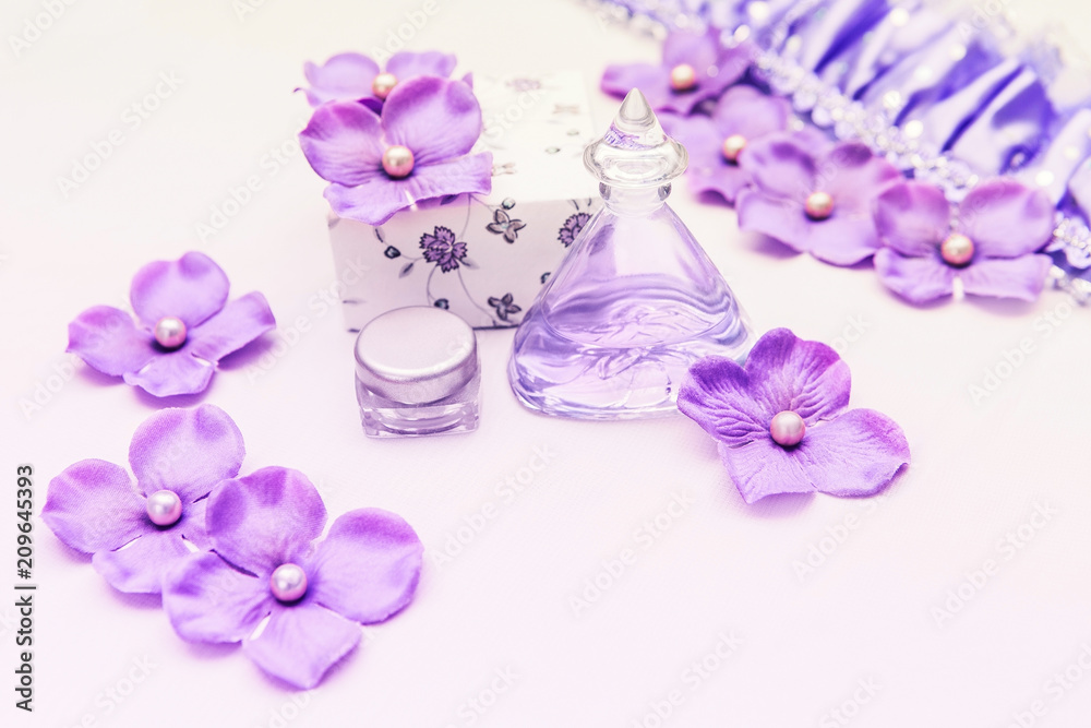 perfume bottle with a box and some purple and pink decorations on white background, woman cosmetics perfume bottle with a box and some purple and pink decorations on white background, woman cosmetics