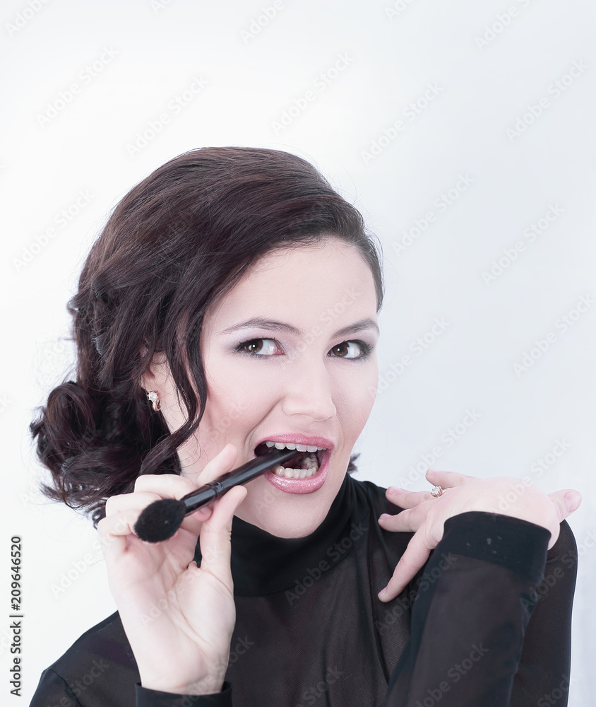 stylish young woman with brush for makeup stylish young woman with brush for makeup